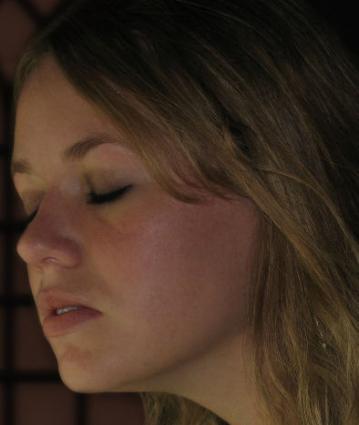 girl with eyes closed