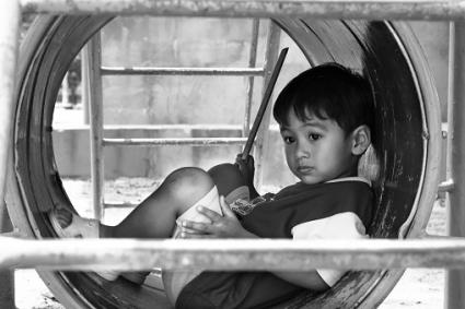 boy alone on playground