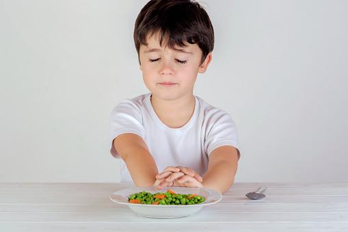 boy eating vegetables