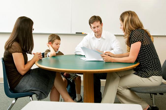 team of adults meeting about child