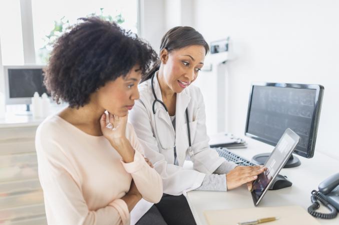doctor and patient talking in office
