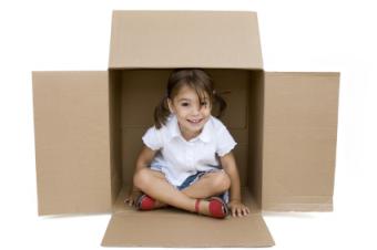 toddler girl in box