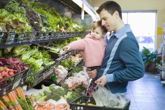 Man and baby girl in supermarket