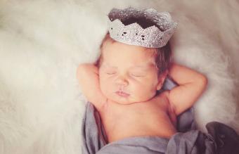 newborn baby wearing silver crown