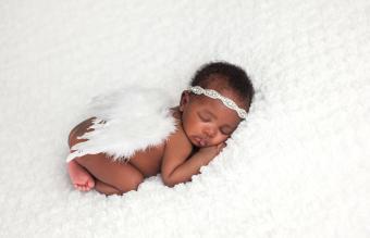 Newborn Baby Girl Wearing Angel Wings