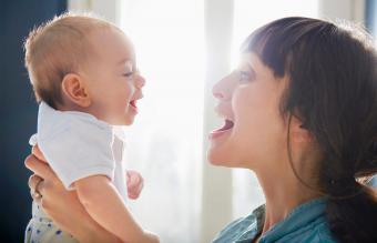 mother and baby laughing