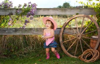 Adorable toddler dressed as a cowgirl