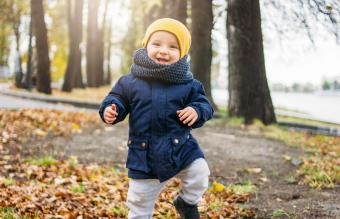 Baby Boy Standing In Park 