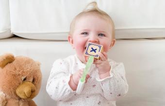 Baby playing with alphabet blocks