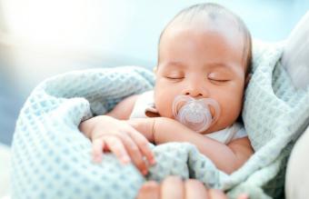 Baby sleeping with pacifier