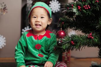 Baby elf at Christmas tree