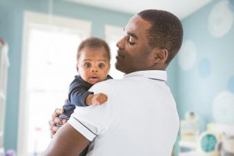 father holding baby son