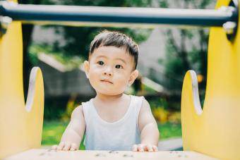 baby is playing outside