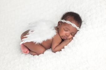 Newborn Baby Girl Wearing Angel Wings