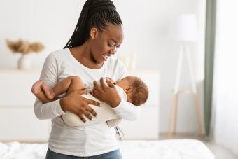 Mother singing lullaby for baby to sleep