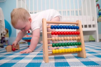baby with crib and toys