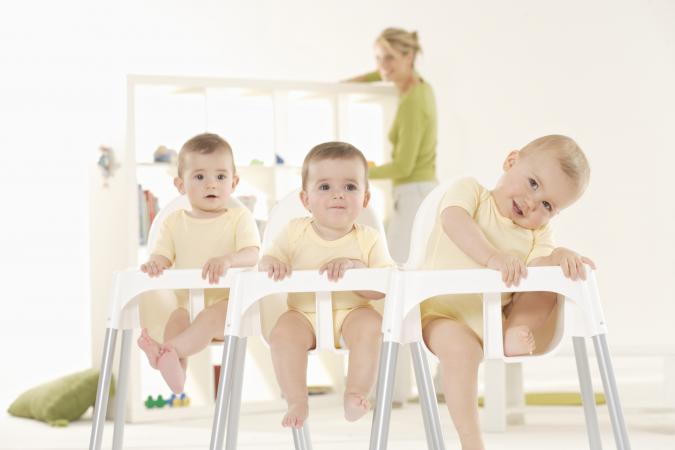 babies sitting in high chairs