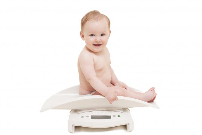 Baby being weighed