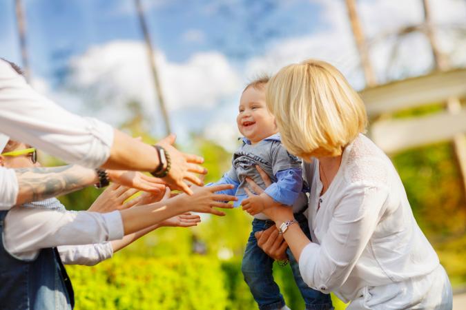 hands reaching out to child