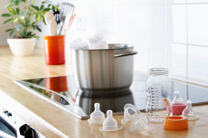 Sanitizing baby bottles on stove