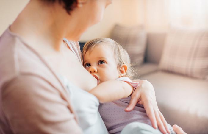 Mother breastfeeding toddler