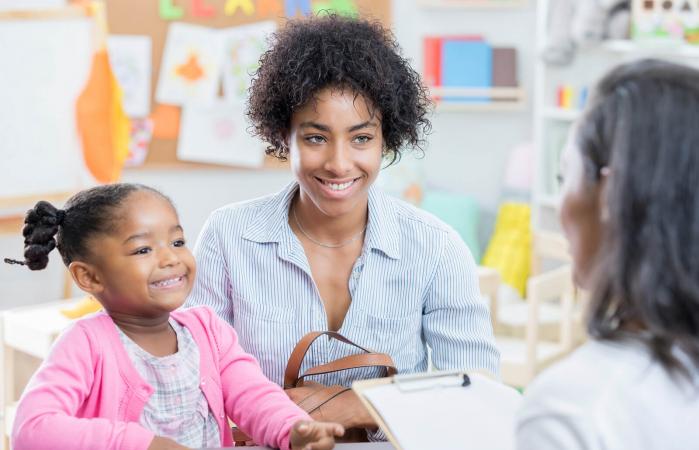 mom talks with teacher during conference