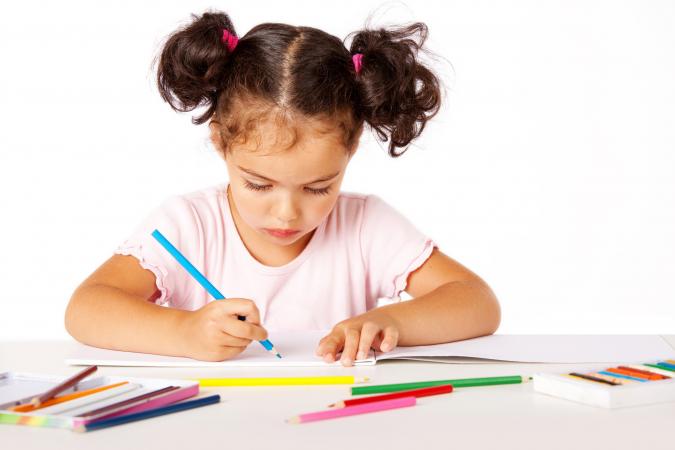 toddler working in a workbook