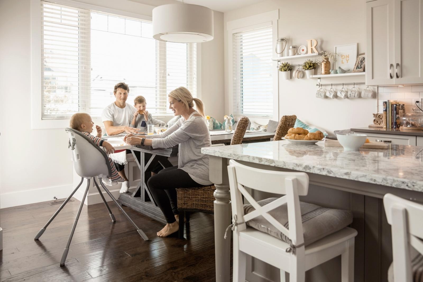 Family with a baby and a small boy having breakfast