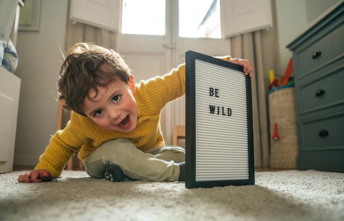 Little boy with "Be Wild" text