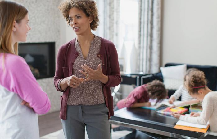 Mother giving instructions to babysitter