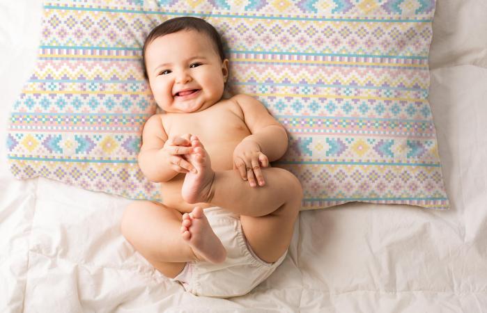 Cute baby on aztec pillow