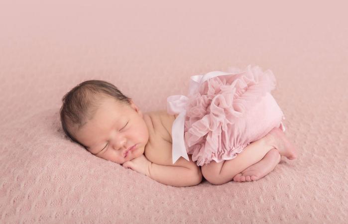 Newborn Baby Girl On Pink