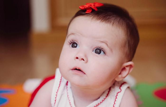 cute baby girl with red hair clip
