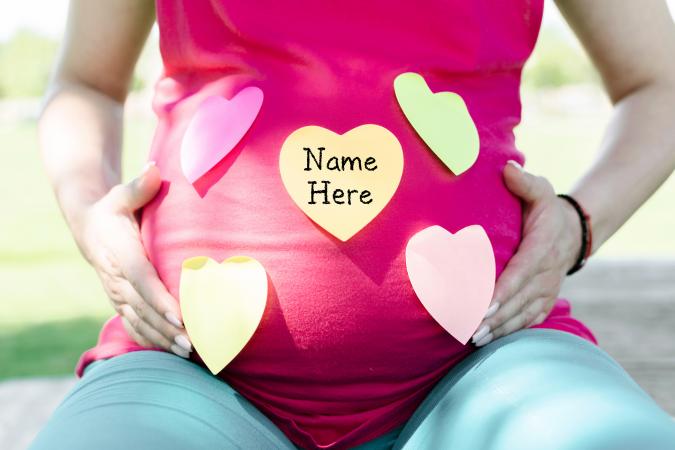 Pregnant woman choosing a name for a baby