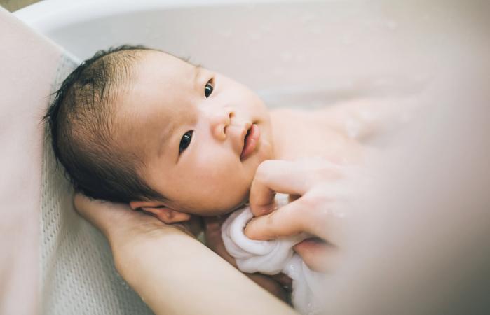 bathing new born baby