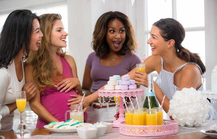 friends laughing at baby shower