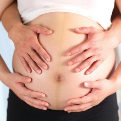 pregnant belly with hands