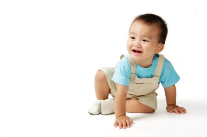 Baby about to reach the crawling milestone