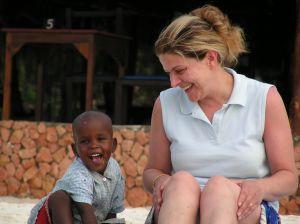 Child care provider watching a small boy