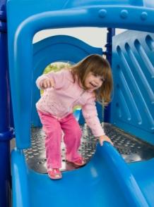 Child on playground slide