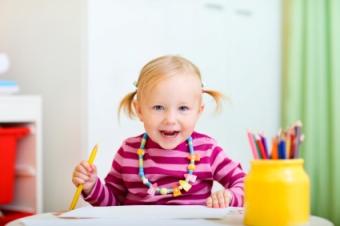 little girl with pencils