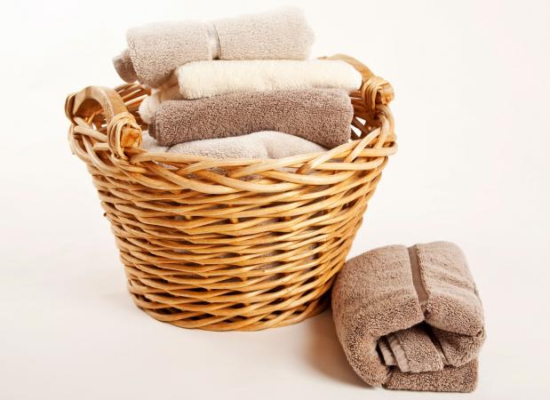 fluffy folded towels in basket