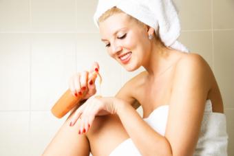 woman applying lotion