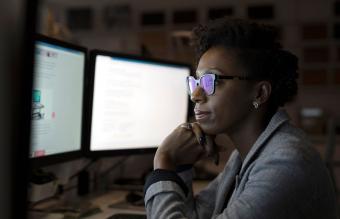 Businesswoman working late at computers