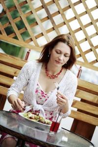 Woman eating at restaurant