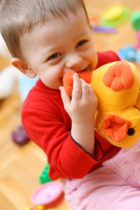 Boy holding toy duck