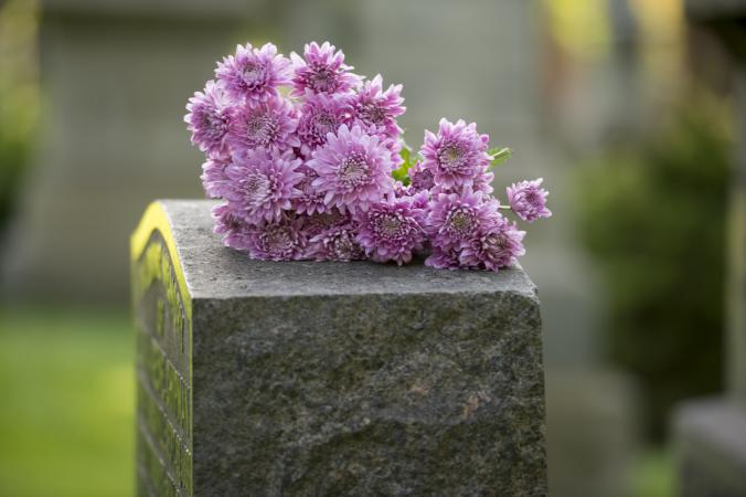 Purple flowers on a headstone
