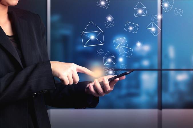 Business woman sending email