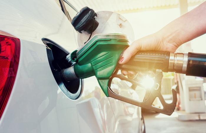 Woman Refueling Car