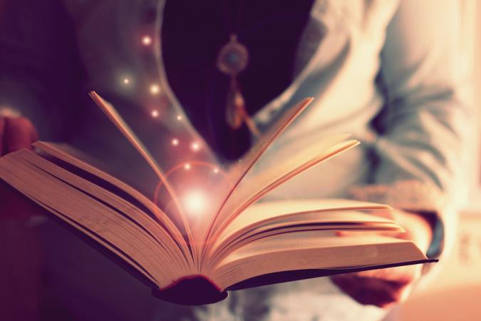 man thumbing through book